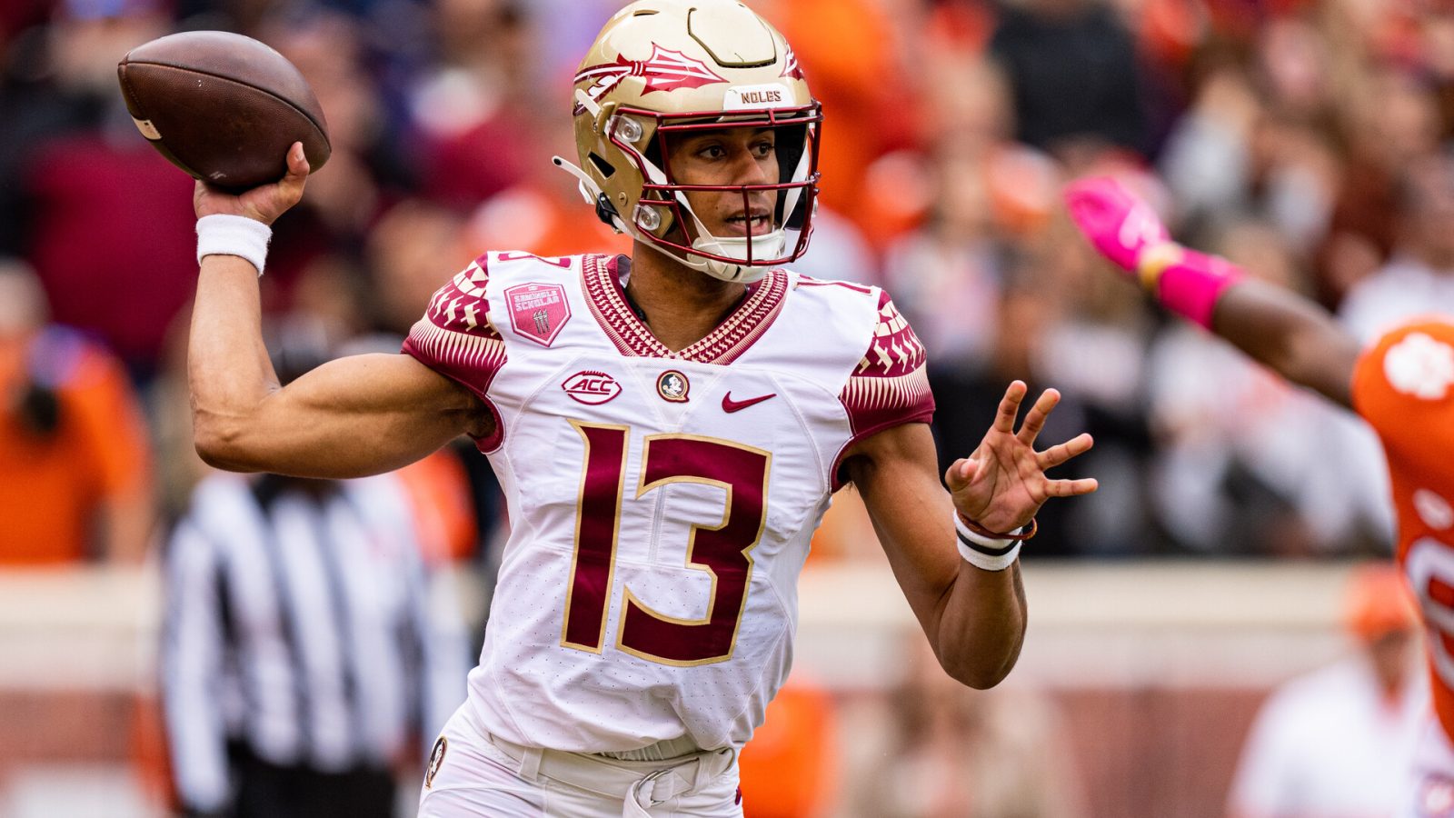 Quarterback Jordan Travis #13 of the Florida State Seminoles looks to pass against the Clemson Tigers during their game at Clemson Memorial Stadium on October 30, 2021 in Clemson, South Carolina.