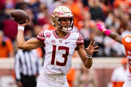 Quarterback Jordan Travis #13 of the Florida State Seminoles looks to pass against the Clemson Tigers during their game at Clemson Memorial Stadium on October 30, 2021 in Clemson, South Carolina.