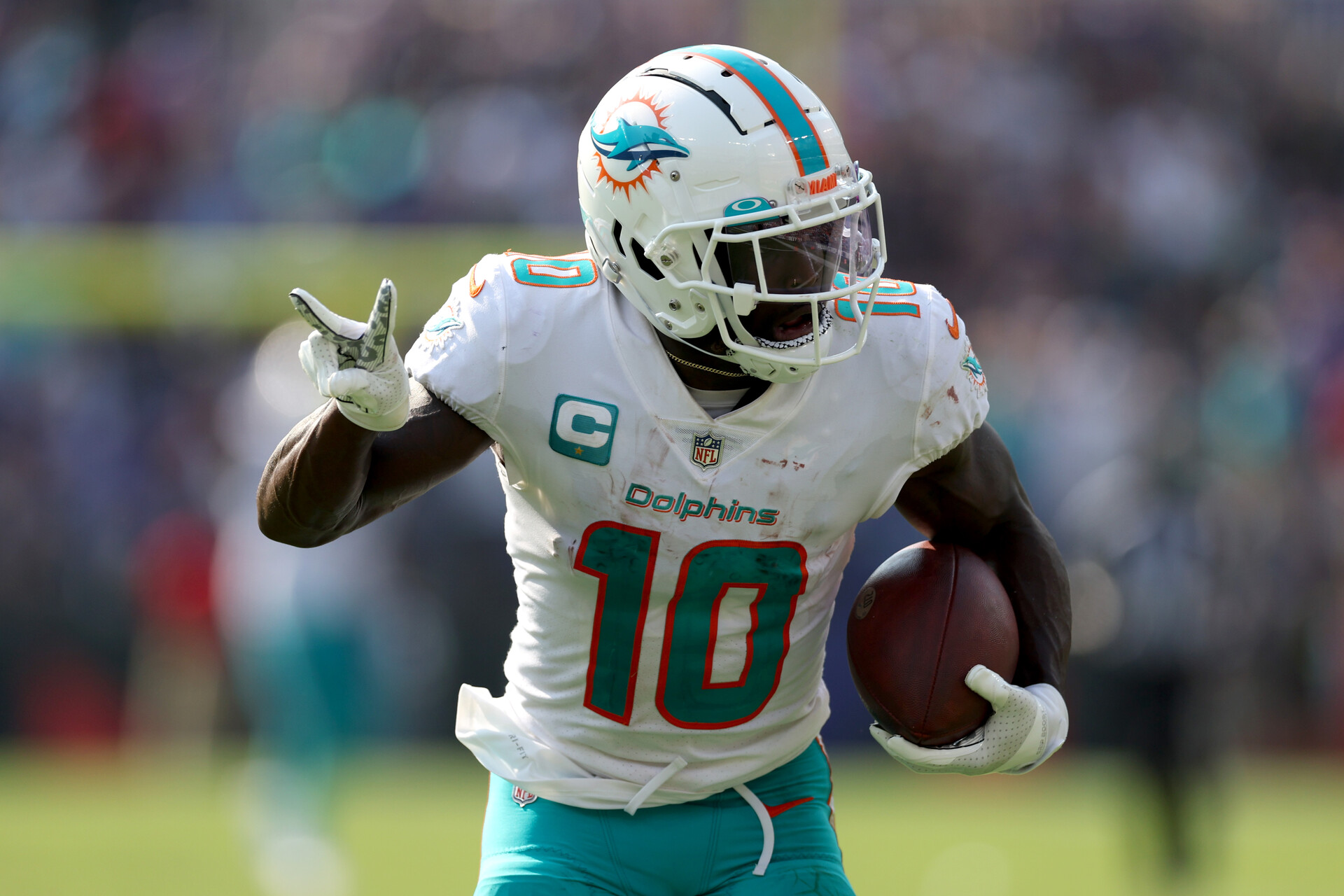 Wide receiver Tyreek Hill #10 of the Miami Dolphins celebrates while scoring his second pass touchdown against the Baltimore Ravens at M&T Bank Stadium on September 18, 2022 in Baltimore, Maryland.