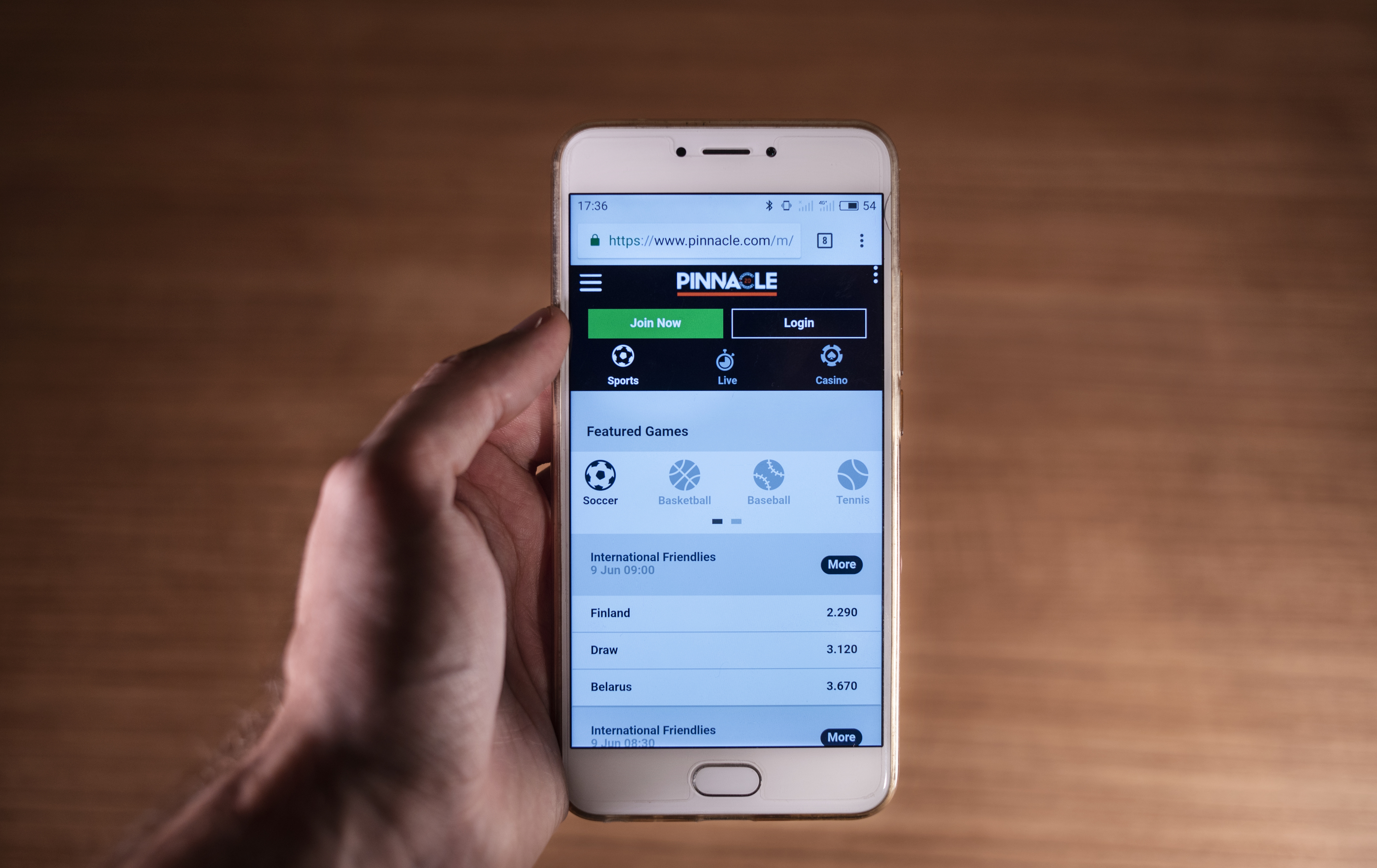 In this photo illustration, the Curaçao based online gambling and casino games company, Pinnacle, website is displayed on a smartphone.