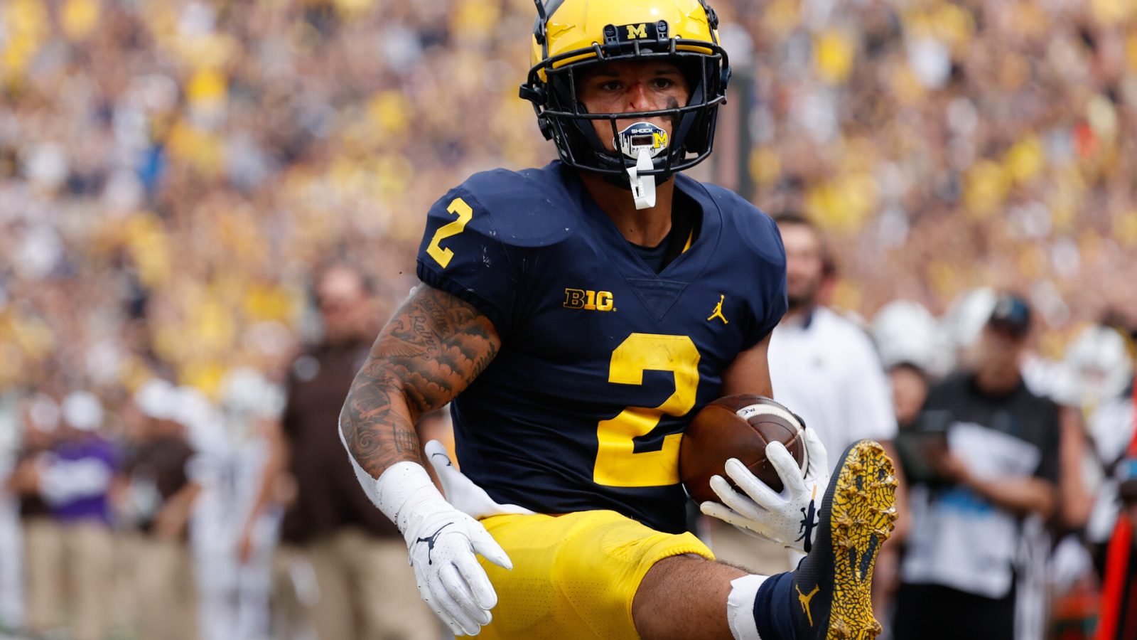 Michigan Wolverines running back Blake Corum (2) rushes for a touchdown in the first half against the Western Michigan Broncos at Michigan Stadium.