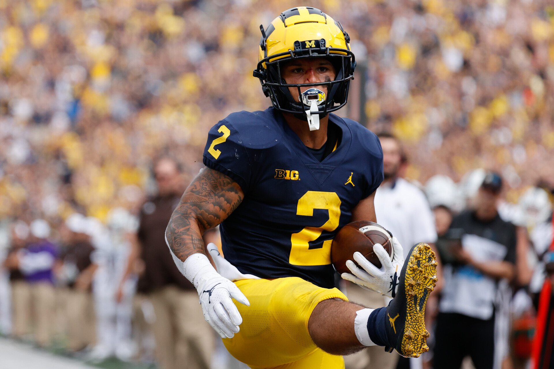 Michigan Wolverines running back Blake Corum (2) rushes for a touchdown in the first half against the Western Michigan Broncos at Michigan Stadium.