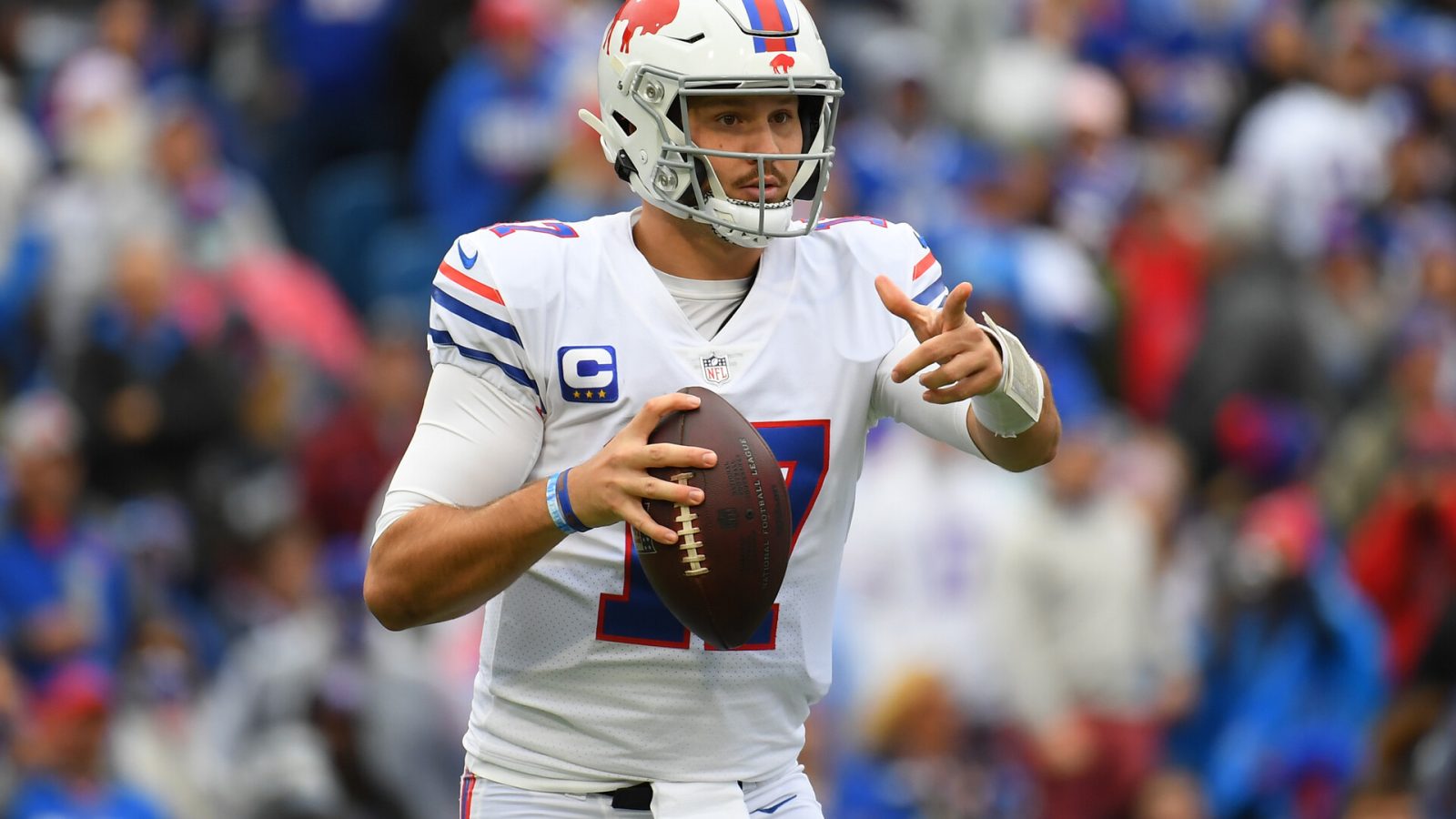 Buffalo Bills quarterback Josh Allen (17) gestures while dropping back to pass against the Miami Dolphins during the first half at Highmark Stadium.