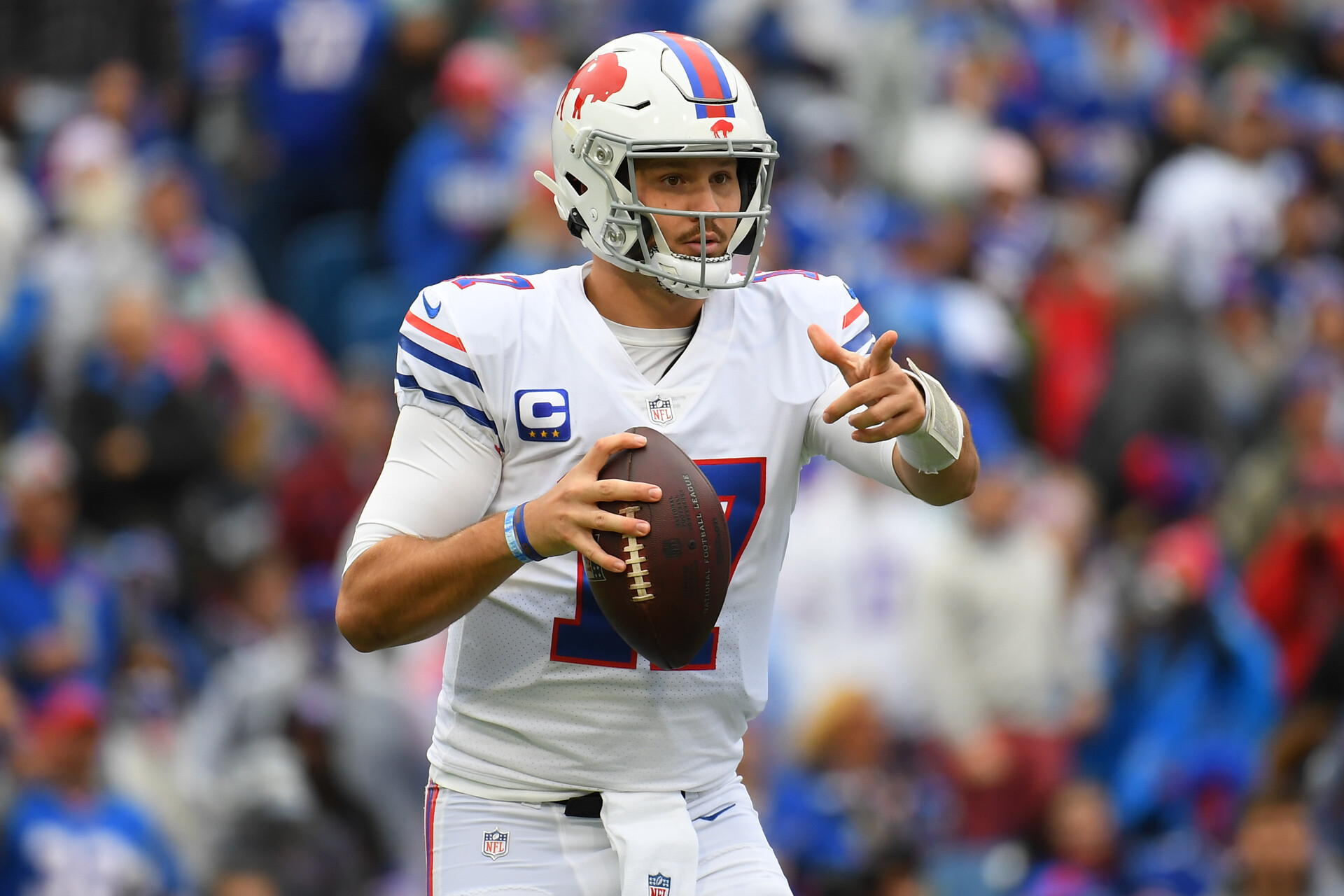 Buffalo Bills quarterback Josh Allen (17) gestures while dropping back to pass against the Miami Dolphins during the first half at Highmark Stadium.