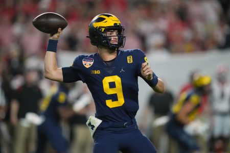 Dec 31, 2021; Miami Gardens, FL, USA; Michigan Wolverines quarterback J.J. McCarthy (9) throws against the Georgia Bulldogs during the fourth quarter in the Orange Bowl college football CFP national semifinal game at Hard Rock Stadium.