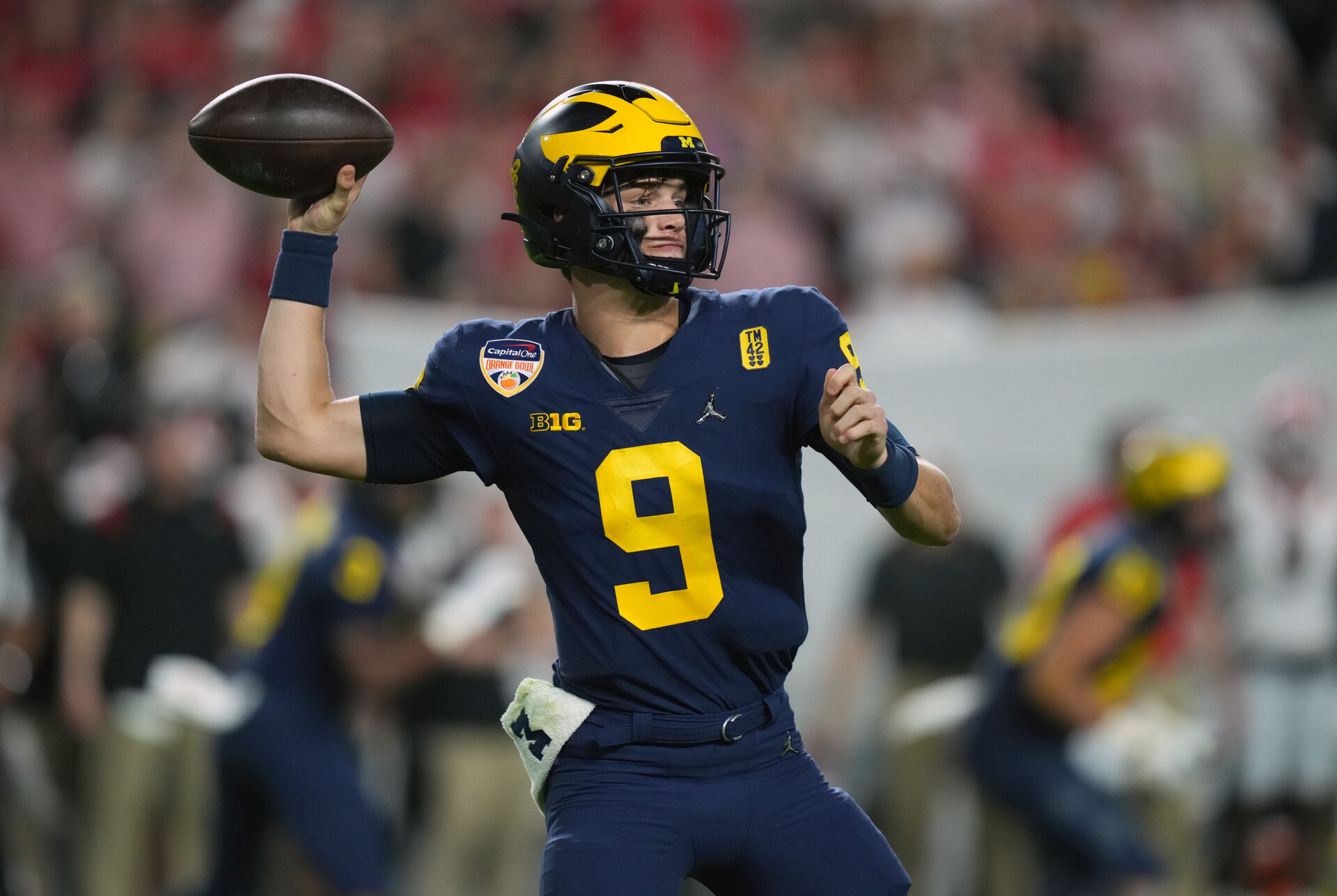 Dec 31, 2021; Miami Gardens, FL, USA; Michigan Wolverines quarterback J.J. McCarthy (9) throws against the Georgia Bulldogs during the fourth quarter in the Orange Bowl college football CFP national semifinal game at Hard Rock Stadium.