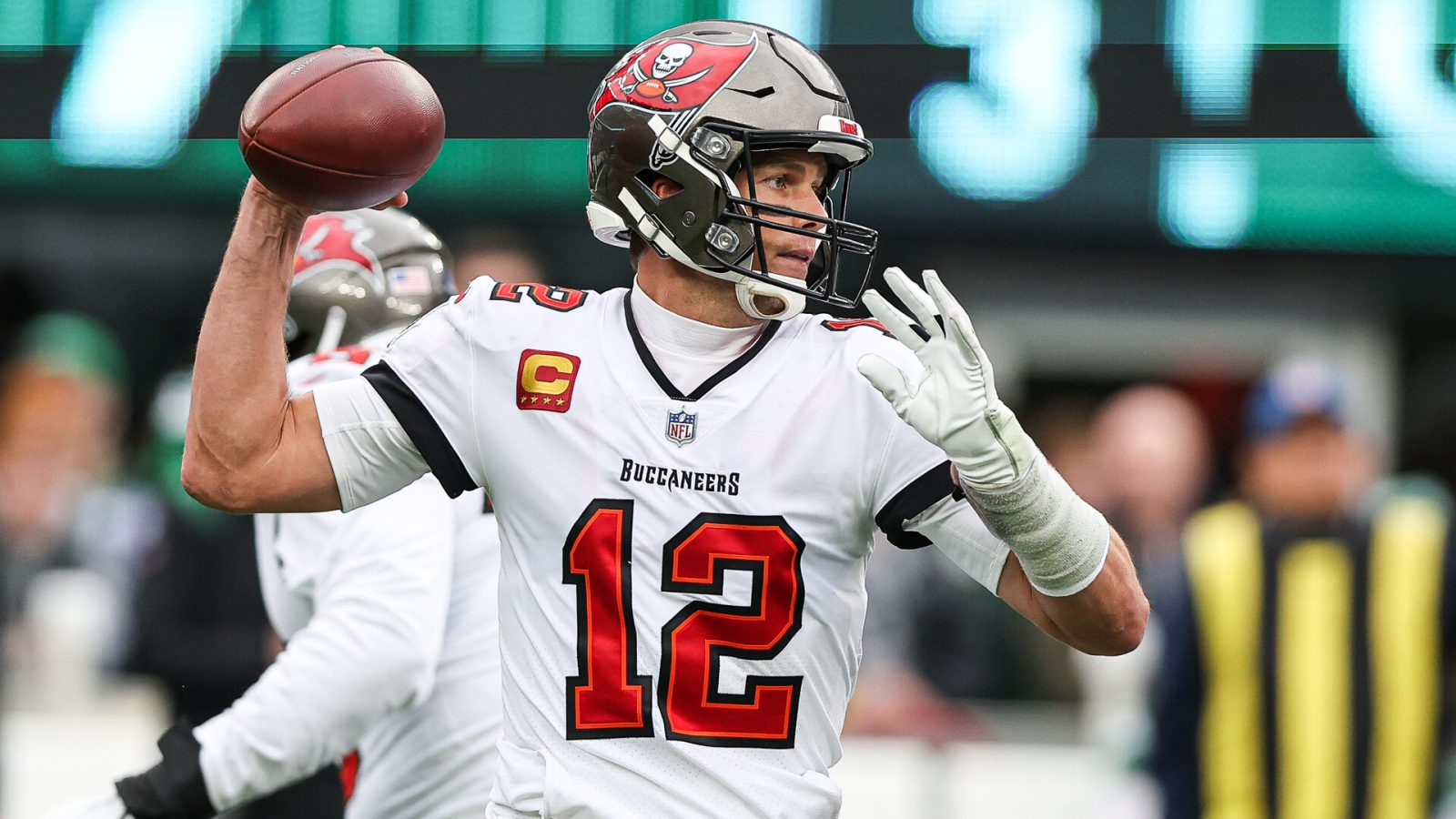 Jan 2, 2022; East Rutherford, New Jersey, USA; Tampa Bay Buccaneers quarterback Tom Brady (12) throws the ball against the New York Jets during the first quarter at MetLife Stadium.