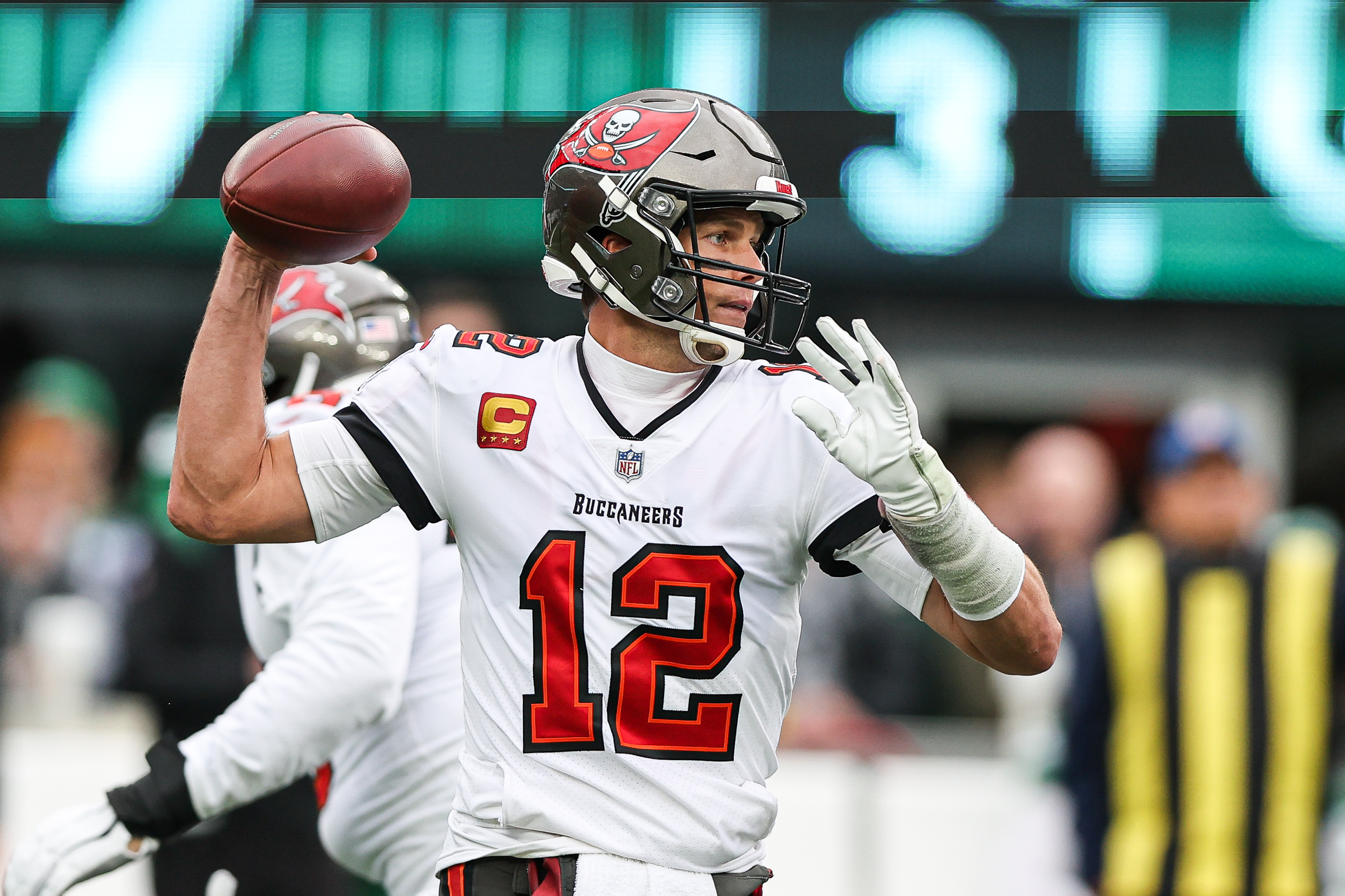 Jan 2, 2022; East Rutherford, New Jersey, USA; Tampa Bay Buccaneers quarterback Tom Brady (12) throws the ball against the New York Jets during the first quarter at MetLife Stadium.