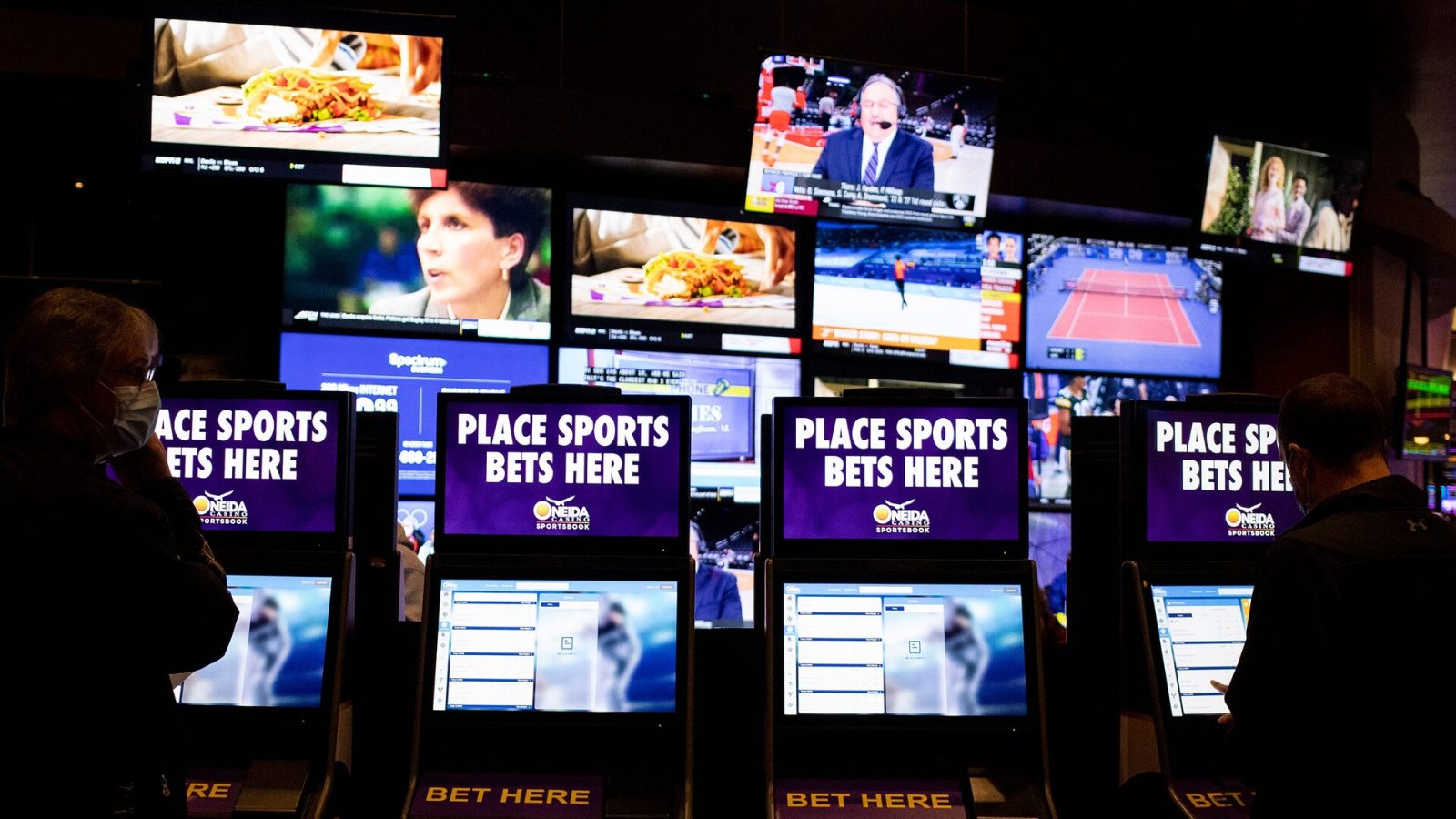 Customers place bets at a kiosks, Thursday, Feb. 10, 2022, at the Oneida Casino in Green Bay, Wis.