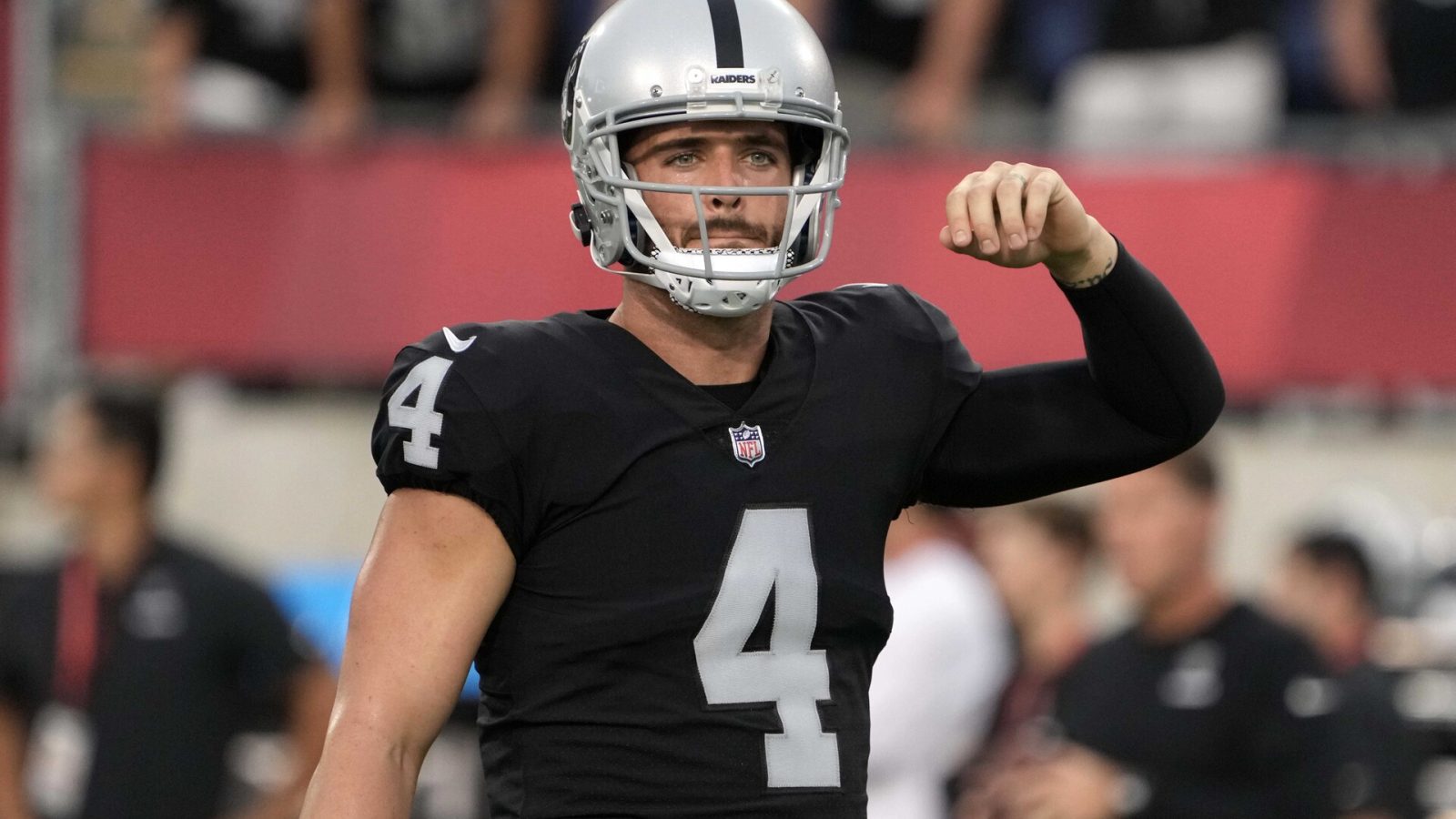 Aug 4, 2022; Canton, Ohio, USA; Las Vegas Raiders quarterback Derek Carr (4) gestures during the Pro Football Hall of Fame game against the Jacksonville Jaguars at Tom Benson Hall of Fame Stadium.