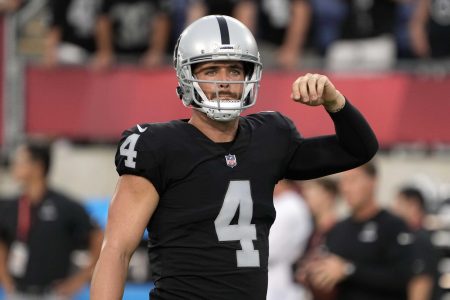 Aug 4, 2022; Canton, Ohio, USA; Las Vegas Raiders quarterback Derek Carr (4) gestures during the Pro Football Hall of Fame game against the Jacksonville Jaguars at Tom Benson Hall of Fame Stadium.