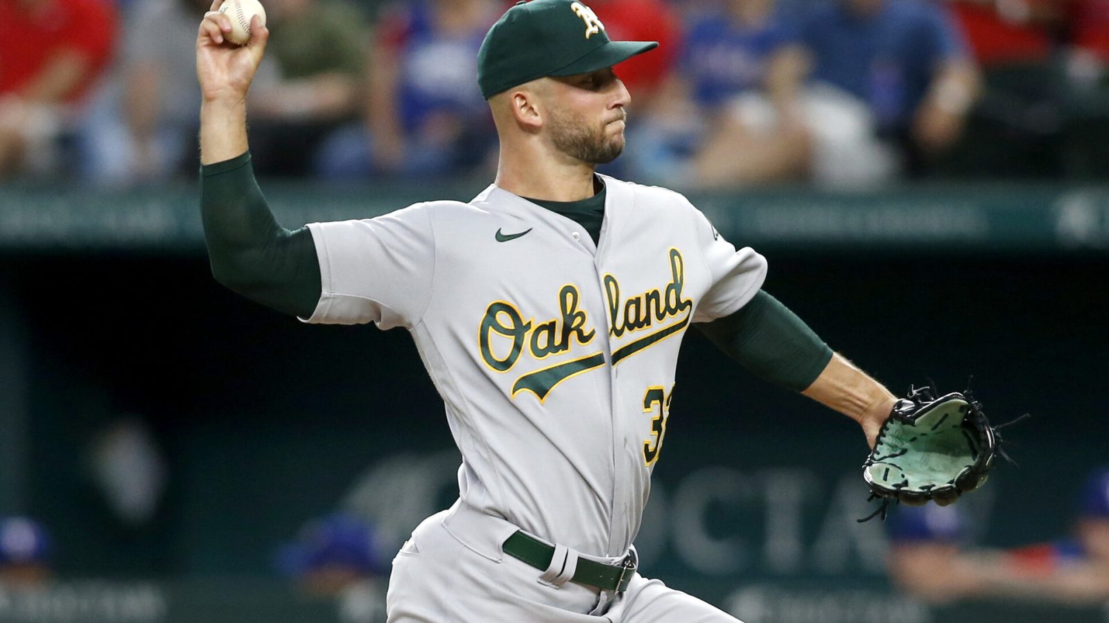 Aug 15, 2022; Arlington, Texas, USA; Oakland Athletics starting pitcher James Kaprielian (32) throws in the first inning against the Texas Rangers at Globe Life Field.