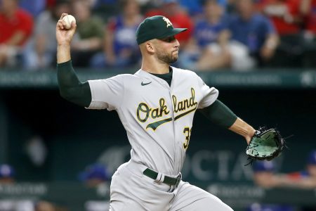 Aug 15, 2022; Arlington, Texas, USA; Oakland Athletics starting pitcher James Kaprielian (32) throws in the first inning against the Texas Rangers at Globe Life Field.