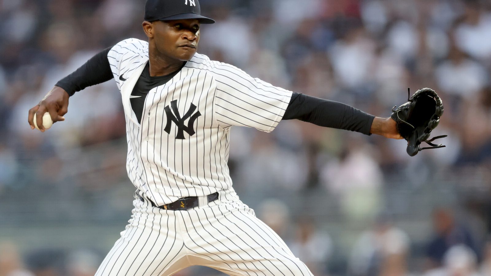 New York Yankees starting pitcher Domingo German (55) pitches against the Tampa Bay Rays during the first inning at Yankee Stadium.