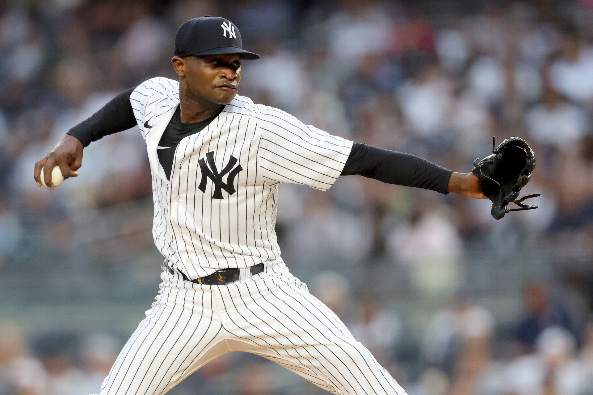 New York Yankees starting pitcher Domingo German (55) pitches against the Tampa Bay Rays during the first inning at Yankee Stadium.