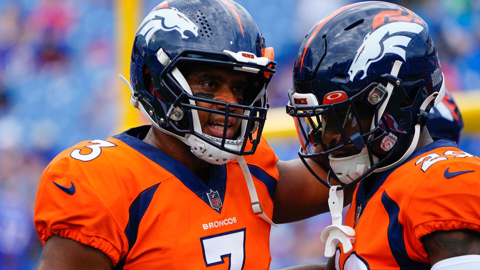 Denver Broncos quarterback Russell Wilson (3) speaks with Denver Broncos wide receiver Seth Williams (19) prior to the game against the Buffalo Bills at Highmark Stadium.
