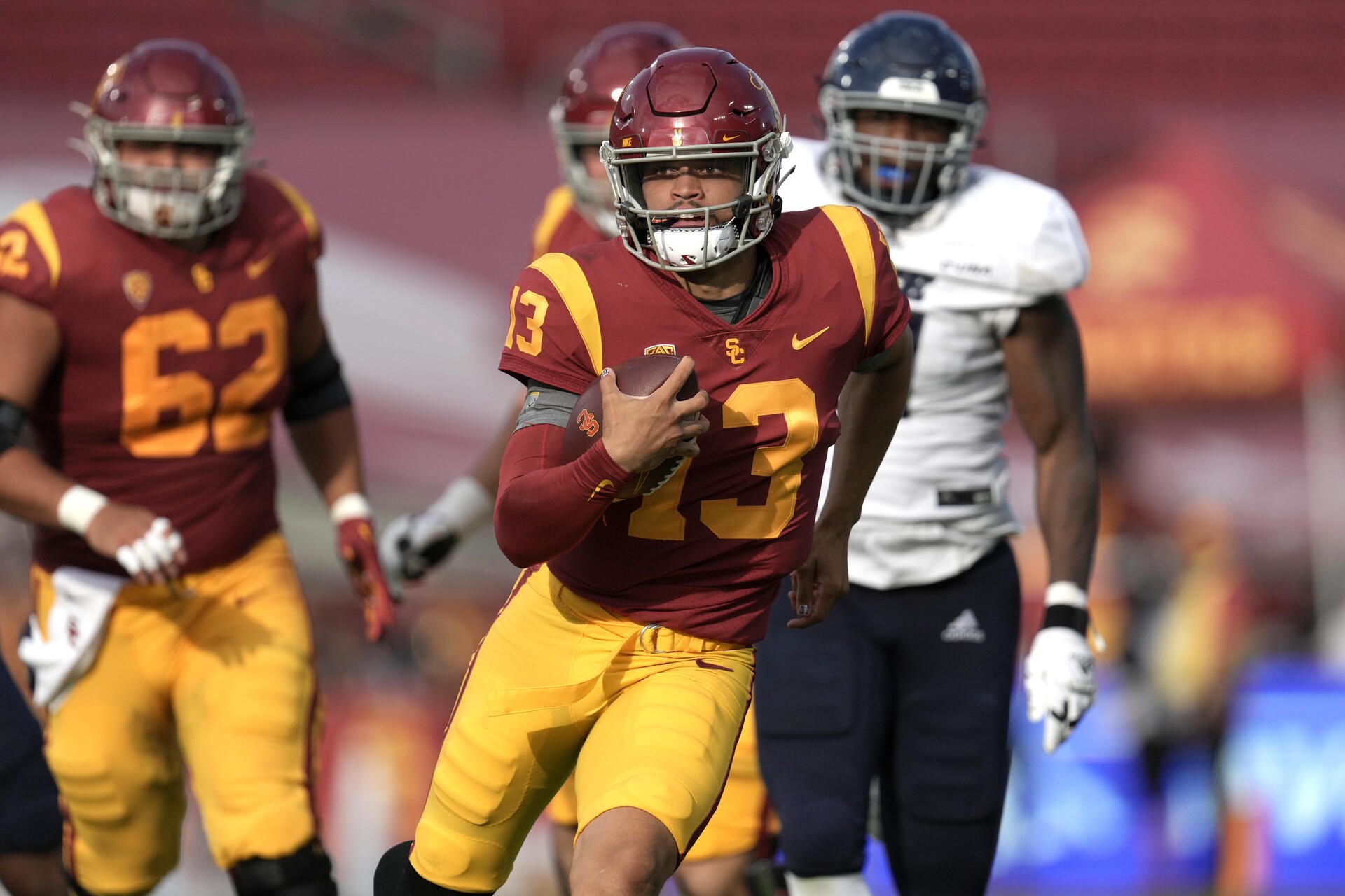 Sep 3, 2022; Los Angeles, California, USA; Southern California Trojans quarterback Caleb Williams (13) carries the ball against the Rice Owls in the second half at United Airlines Field at Los Angeles Memorial Coliseum.