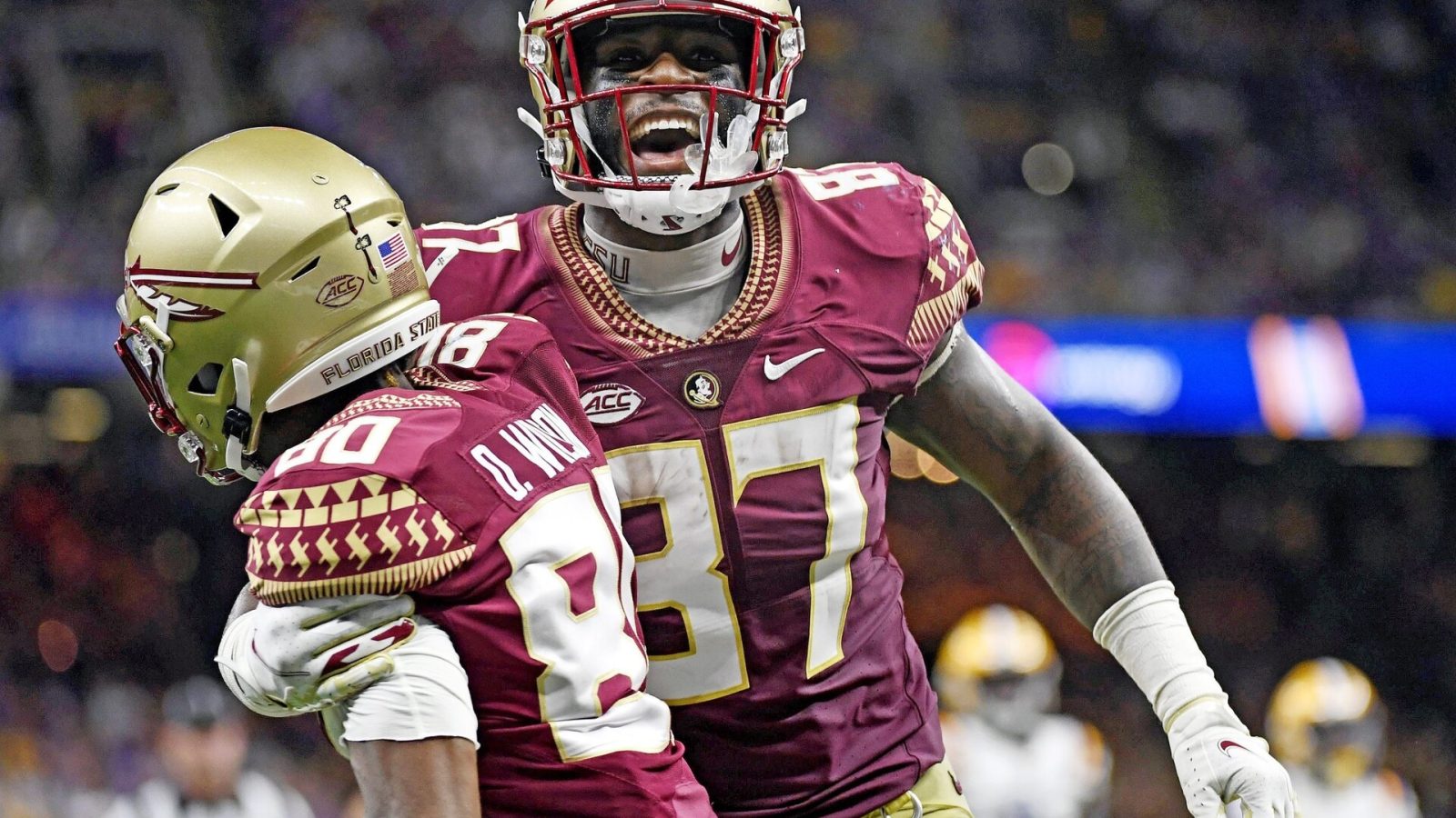 Sep 4, 2022; New Orleans, Louisiana, USA; Florida State Seminoles tight end Camren McDonald (87) celebrates with wide receiver Ontaria Wilson (80) after scoring a touchdow during the first half against the Louisiana State Tigers at Caesars Superdome.
