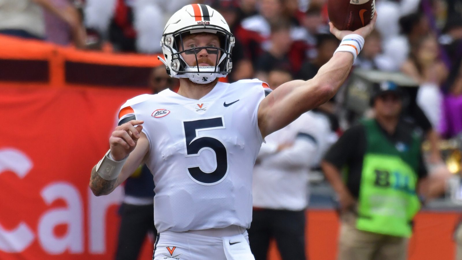 Sep 10, 2022; Champaign, Illinois, USA; Virginia Cavaliers quarterback Brennan Armstrong (5) passes the ball in the first half against the Illinois Fighting Illini at Memorial Stadium.