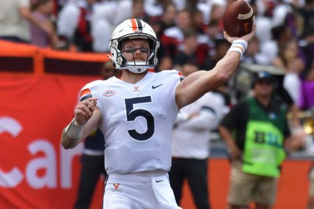 Sep 10, 2022; Champaign, Illinois, USA; Virginia Cavaliers quarterback Brennan Armstrong (5) passes the ball in the first half against the Illinois Fighting Illini at Memorial Stadium.