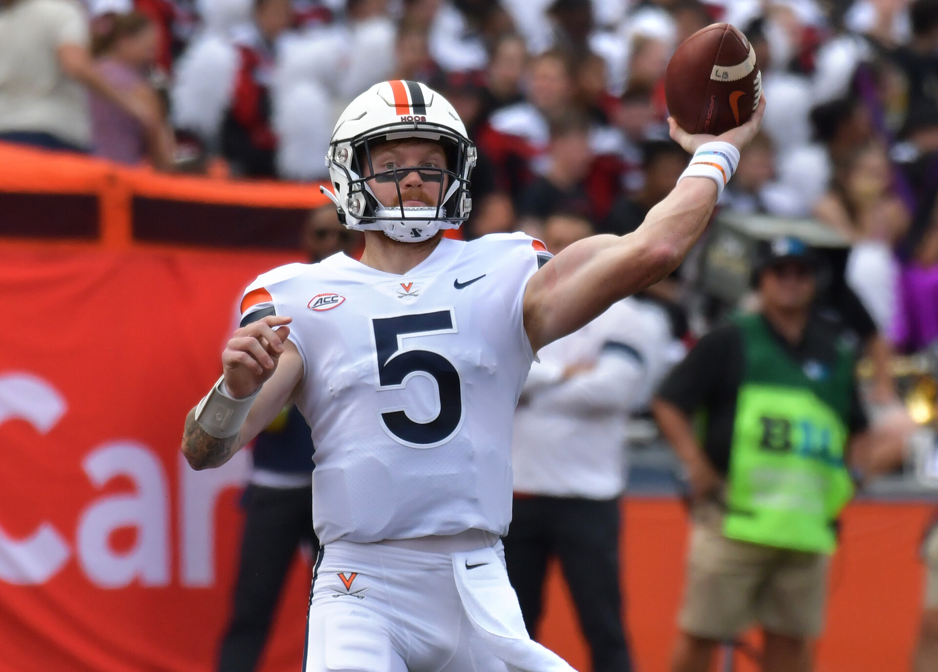Sep 10, 2022; Champaign, Illinois, USA; Virginia Cavaliers quarterback Brennan Armstrong (5) passes the ball in the first half against the Illinois Fighting Illini at Memorial Stadium.