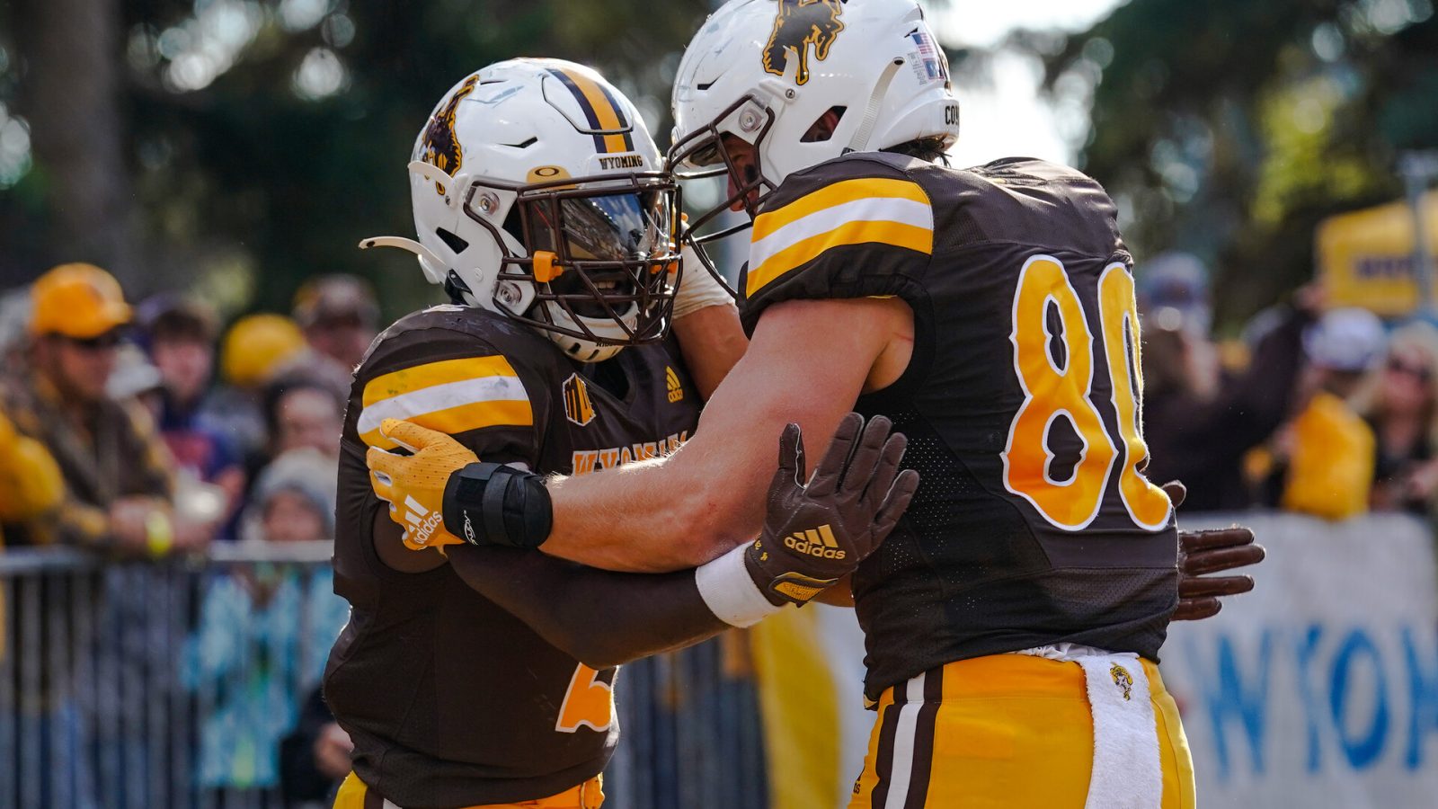 Sep 10, 2022; Laramie, Wyoming, USA; Wyoming Cowboys running back Titus Swen (2) celebrates after a touchdown with teammate Parker Christensen (80) against the Northern Colorado Bears during the fourth quarter at Jonah Field at War Memorial Stadium.