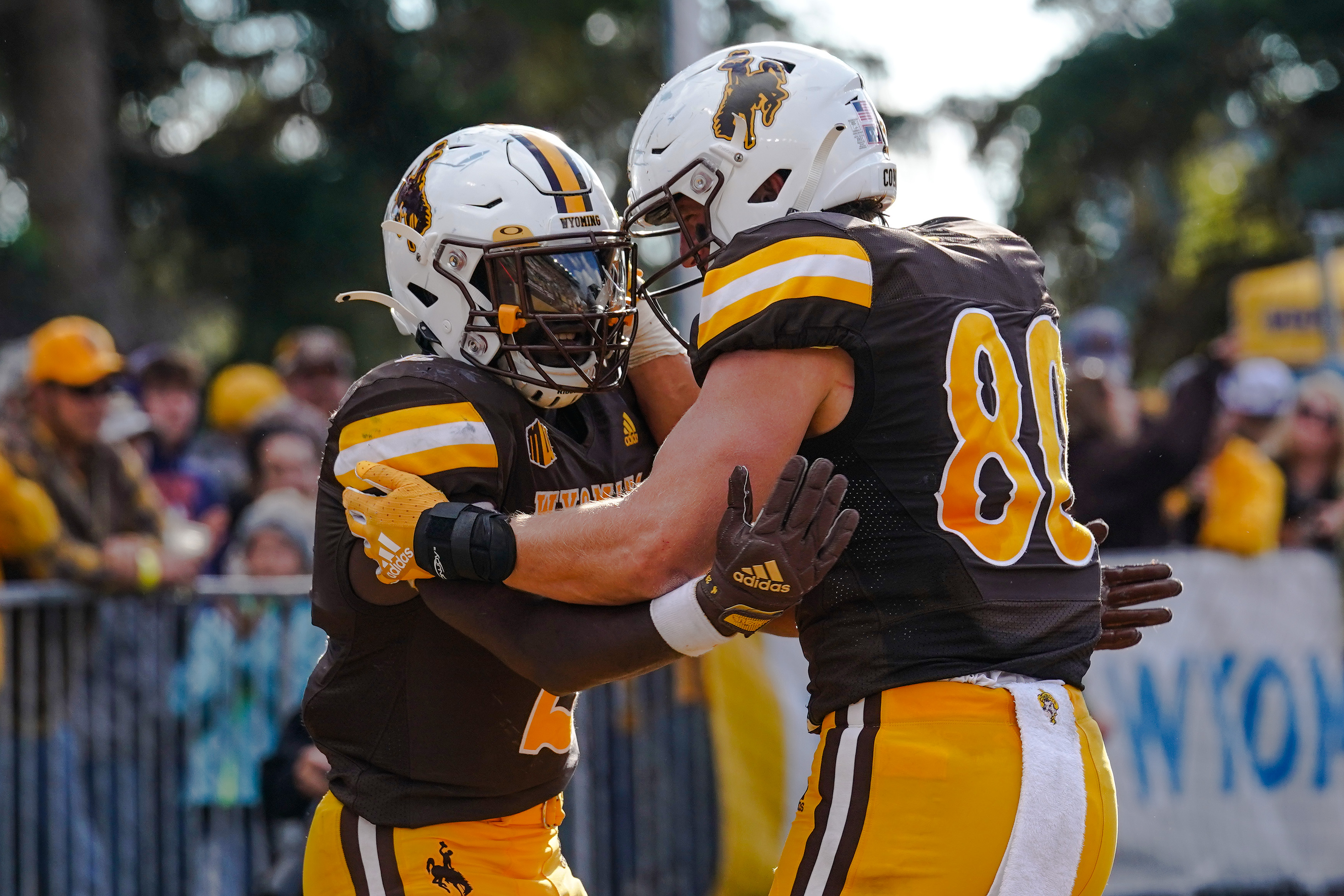 Sep 10, 2022; Laramie, Wyoming, USA; Wyoming Cowboys running back Titus Swen (2) celebrates after a touchdown with teammate Parker Christensen (80) against the Northern Colorado Bears during the fourth quarter at Jonah Field at War Memorial Stadium.