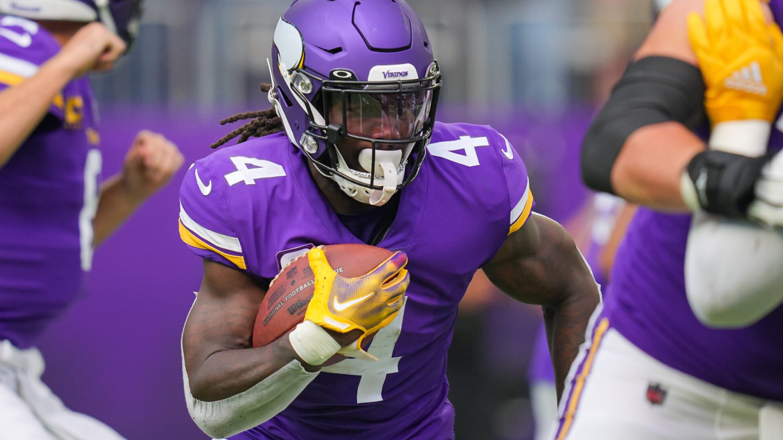 Sep 11, 2022; Minneapolis, Minnesota, USA; Minnesota Vikings running back Dalvin Cook (4) runs with the ball against the Green Bay Packers in the first quarter at U.S. Bank Stadium.