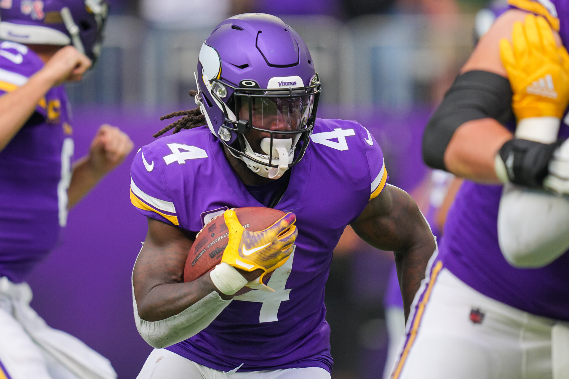 Sep 11, 2022; Minneapolis, Minnesota, USA; Minnesota Vikings running back Dalvin Cook (4) runs with the ball against the Green Bay Packers in the first quarter at U.S. Bank Stadium.
