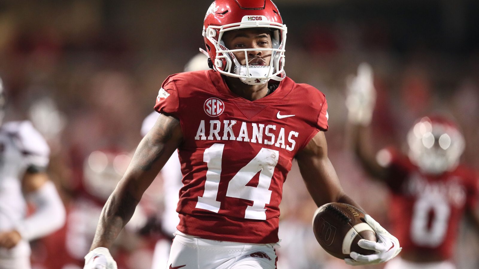 Sep 17, 2022; Fayetteville, Arkansas, USA; Arkansas Razorbacks punt returner Bryce Stephens (14) returns a punt for a touchdown against the Missouri State Bears in the fourth quarter at Donald W. Reynolds Razorback Stadium. Arkansas won 38-27.