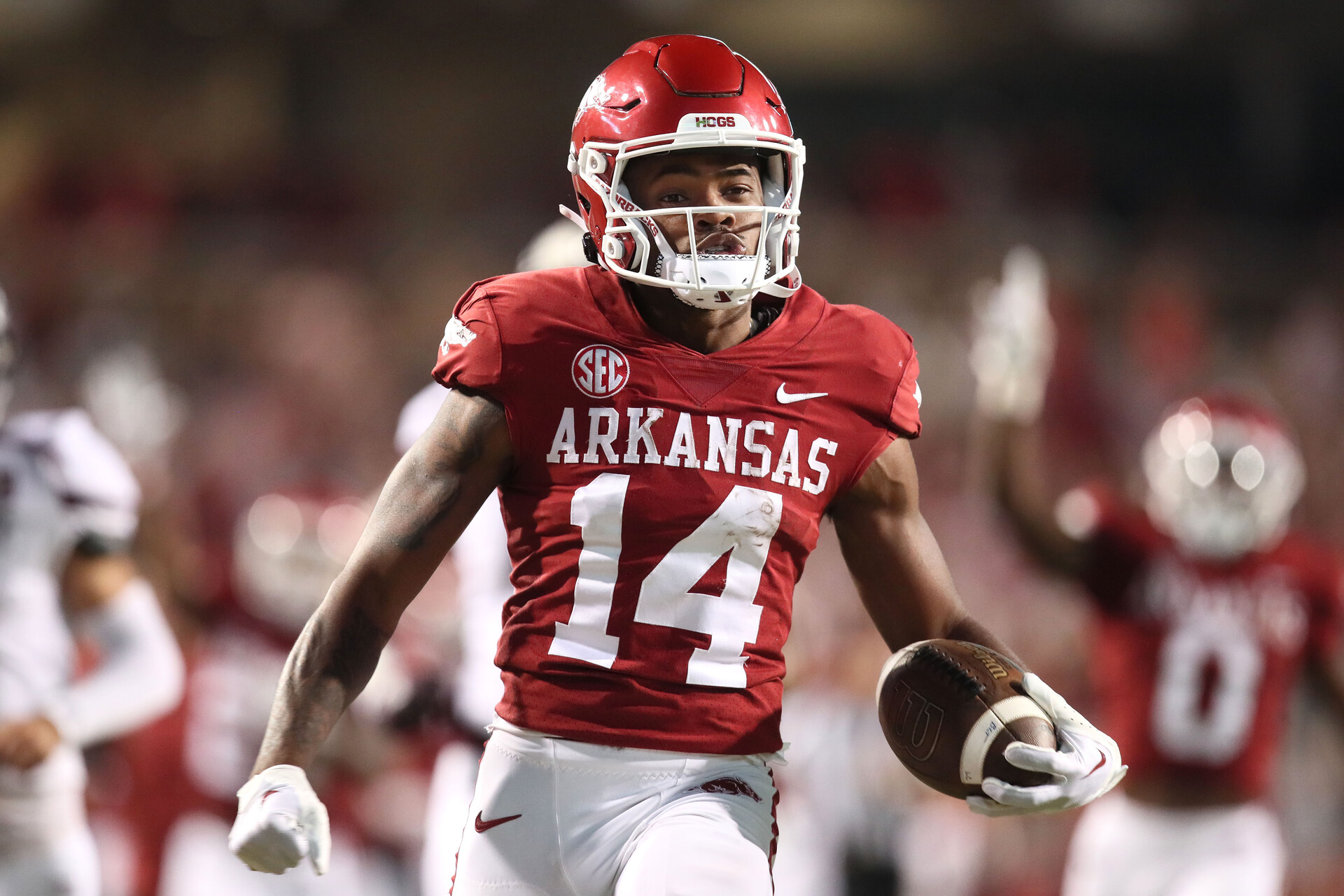 Sep 17, 2022; Fayetteville, Arkansas, USA; Arkansas Razorbacks punt returner Bryce Stephens (14) returns a punt for a touchdown against the Missouri State Bears in the fourth quarter at Donald W. Reynolds Razorback Stadium. Arkansas won 38-27.