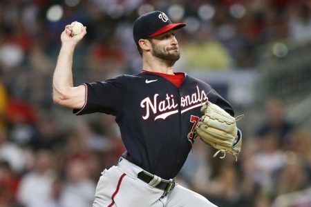 Sep 19, 2022; Atlanta, Georgia, USA; Washington Nationals starting pitcher Cory Abbott (77) throws against the Atlanta Braves in the second inning at Truist Park.