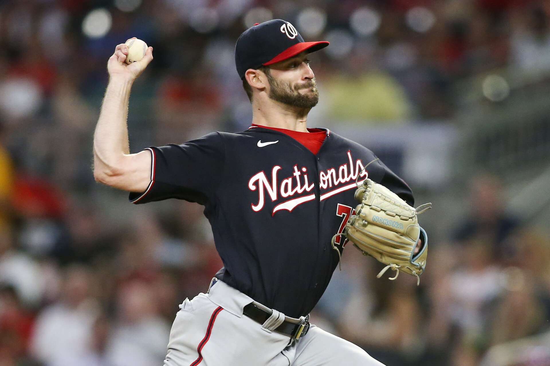 Sep 19, 2022; Atlanta, Georgia, USA; Washington Nationals starting pitcher Cory Abbott (77) throws against the Atlanta Braves in the second inning at Truist Park.