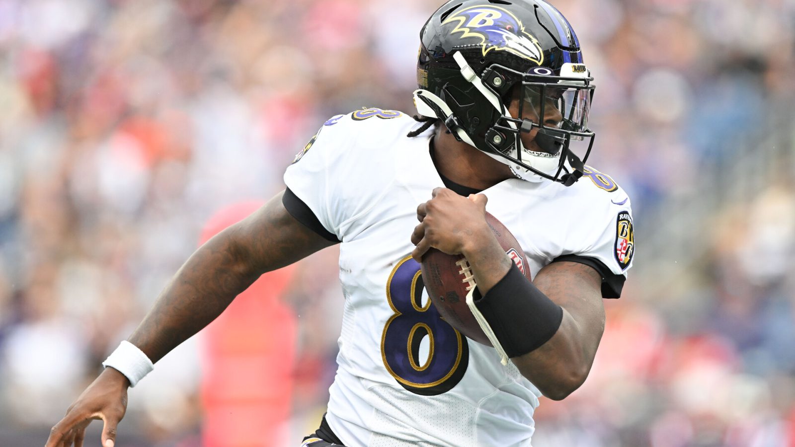 Sep 25, 2022; Foxborough, Massachusetts, USA; Baltimore Ravens quarterback Lamar Jackson (8) runs with ball during the second half of a game against the New England Patriots at Gillette Stadium.