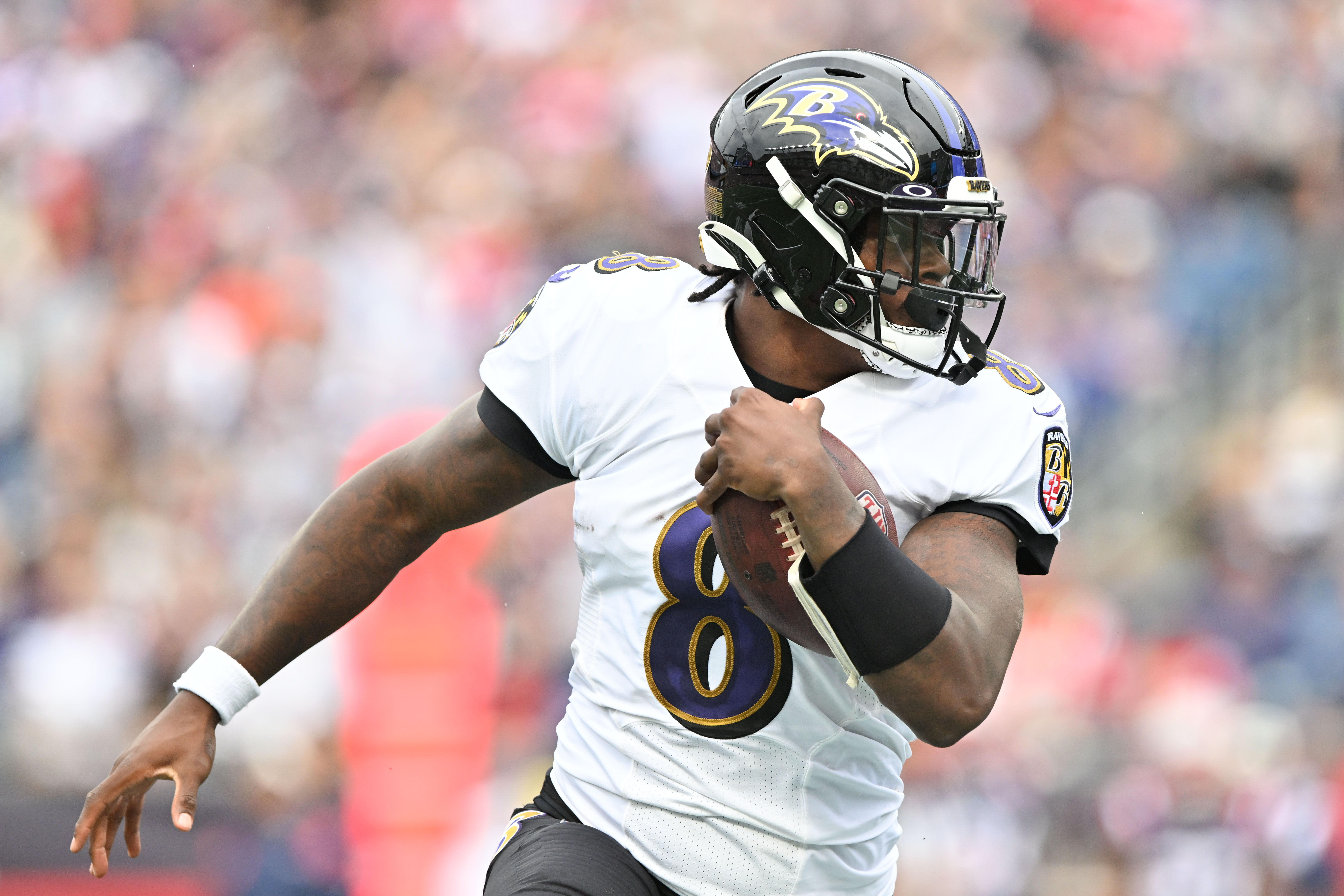 Sep 25, 2022; Foxborough, Massachusetts, USA; Baltimore Ravens quarterback Lamar Jackson (8) runs with ball during the second half of a game against the New England Patriots at Gillette Stadium.
