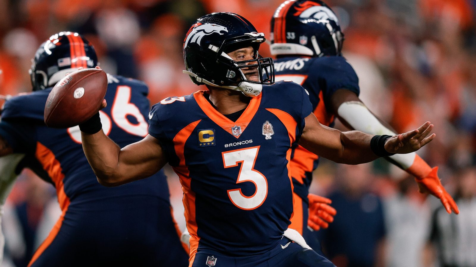 Sep 25, 2022; Denver, Colorado, USA; Denver Broncos quarterback Russell Wilson (3) attempts a throw in the fourth quarter against the San Francisco 49ers at Empower Field at Mile High.
