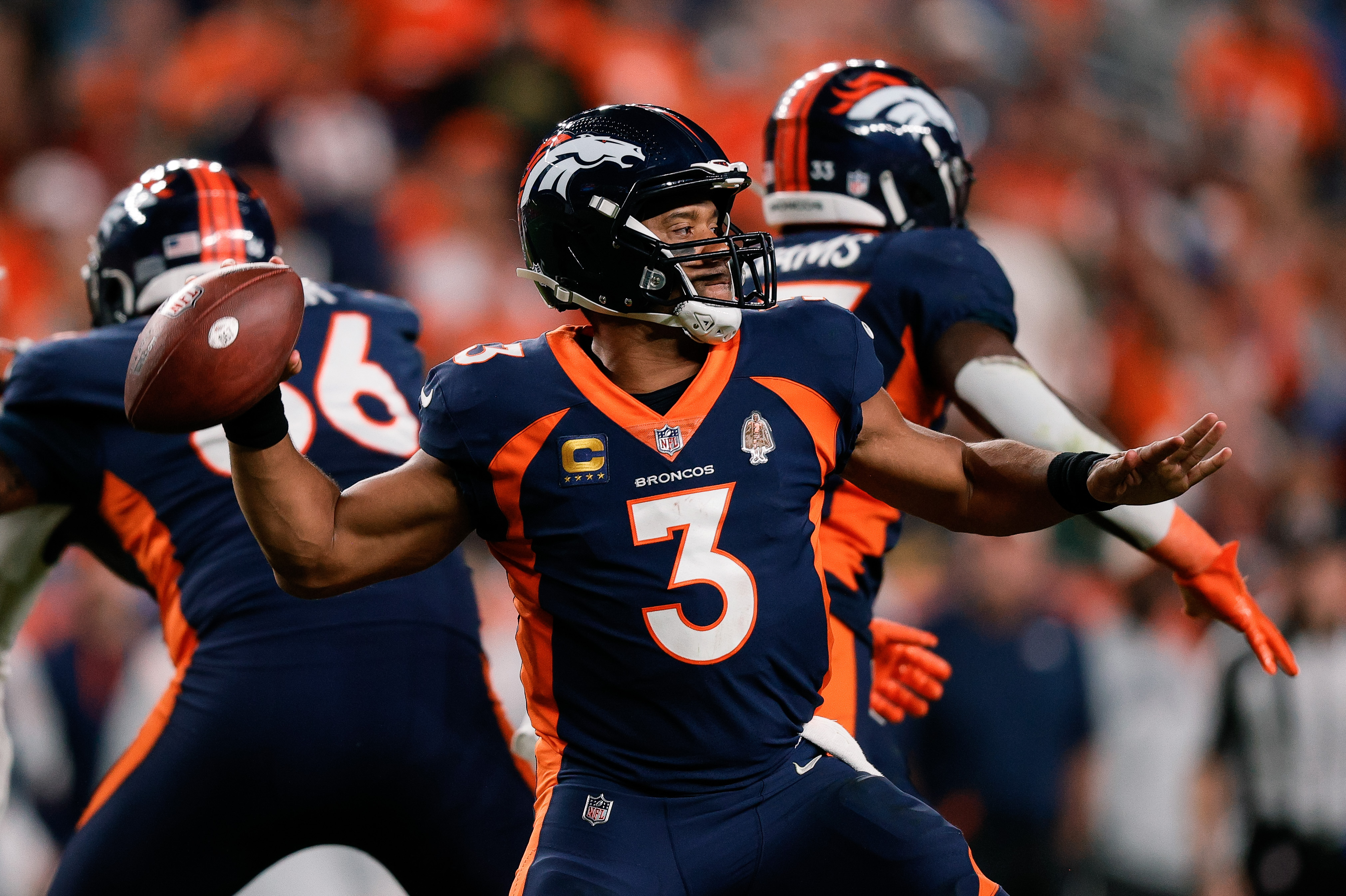 Sep 25, 2022; Denver, Colorado, USA; Denver Broncos quarterback Russell Wilson (3) attempts a throw in the fourth quarter against the San Francisco 49ers at Empower Field at Mile High.