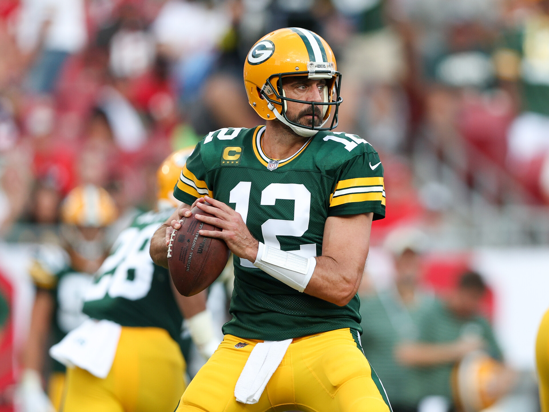 Sep 25, 2022; Tampa, Florida, USA; Green Bay Packers quarterback Aaron Rodgers (12) drops back to pass against the Tampa Bay Buccaneers in the third quarter at Raymond James Stadium