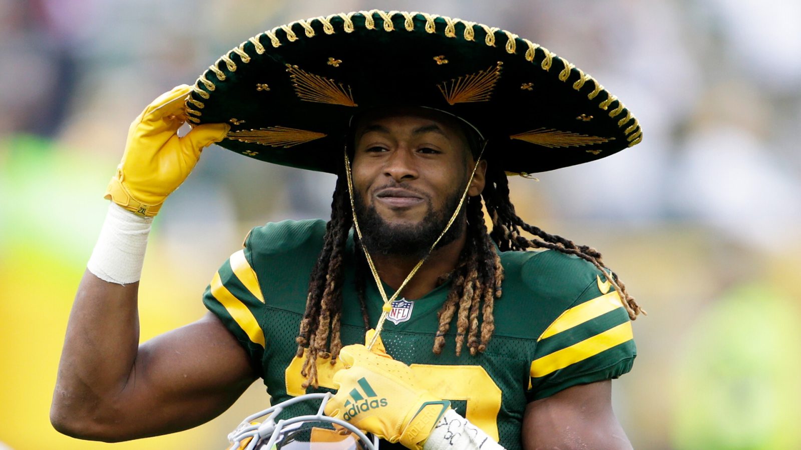 Aaron Jones #33 of the Green Bay Packers puts on the sombrero after the game against the Washington Football Team at Lambeau Field on October 24, 2021 in Green Bay, Wisconsin. Green Bay defeated Washington 24-10.