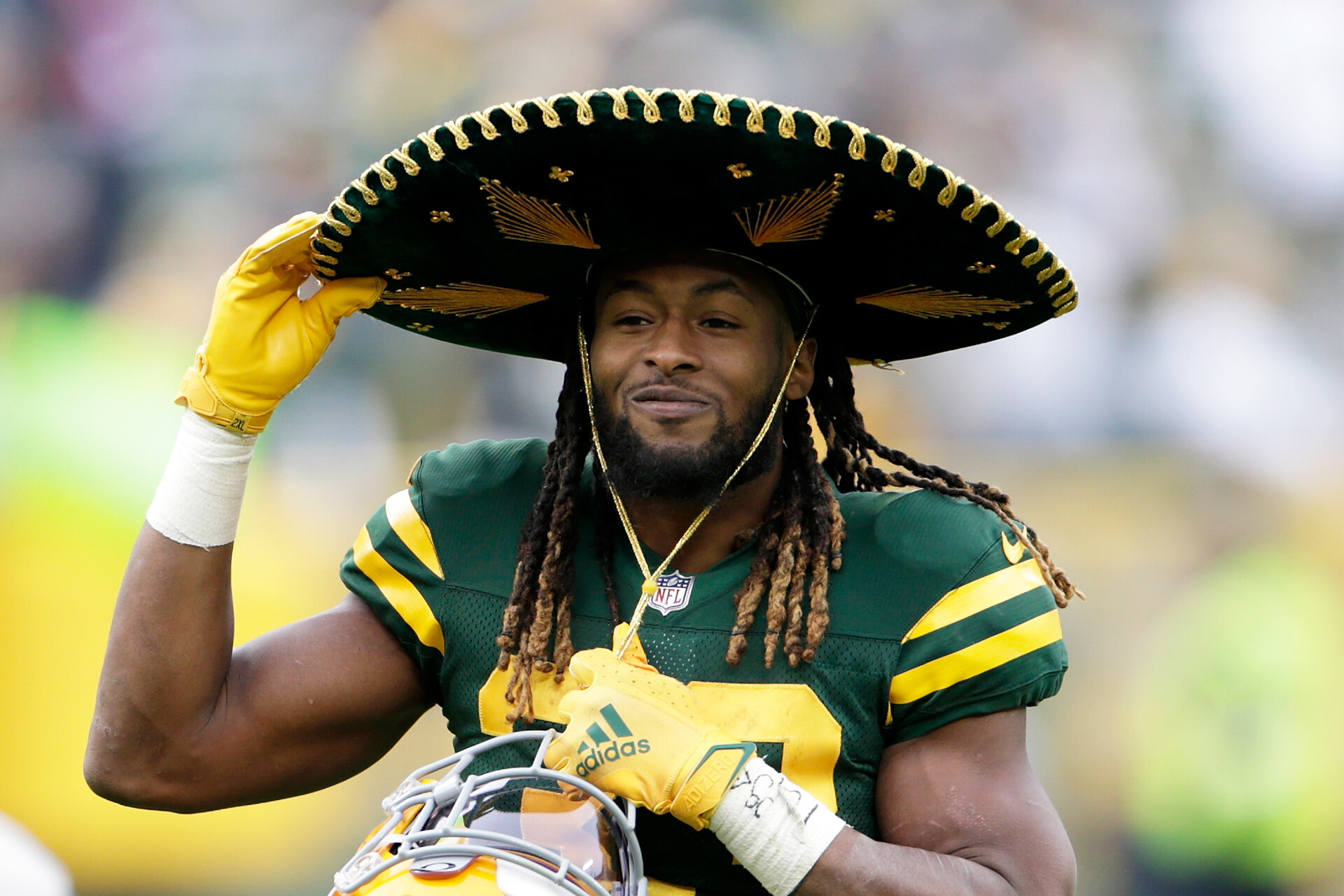 Aaron Jones #33 of the Green Bay Packers puts on the sombrero after the game against the Washington Football Team at Lambeau Field on October 24, 2021 in Green Bay, Wisconsin. Green Bay defeated Washington 24-10.