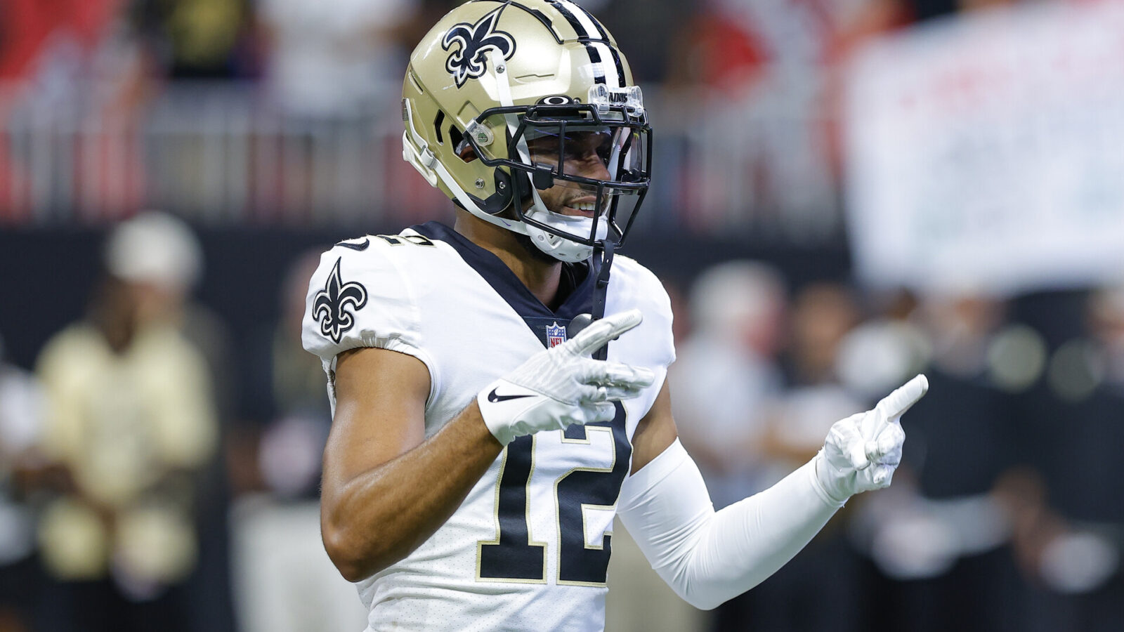 Chris Olave #12 of the New Orleans Saints warms up prior to the game against the Atlanta Falcons at Mercedes-Benz Stadium on September 11, 2022 in Atlanta, Georgia.