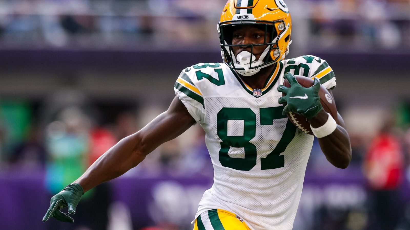 Romeo Doubs #87 of the Green Bay Packers runs with the ball against the Minnesota Vikings in the third quarter of the game at U.S. Bank Stadium on September 11, 2022 in Minneapolis, Minnesota. The Vikings defeated the Packers 23-7.