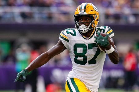 Romeo Doubs #87 of the Green Bay Packers runs with the ball against the Minnesota Vikings in the third quarter of the game at U.S. Bank Stadium on September 11, 2022 in Minneapolis, Minnesota. The Vikings defeated the Packers 23-7.