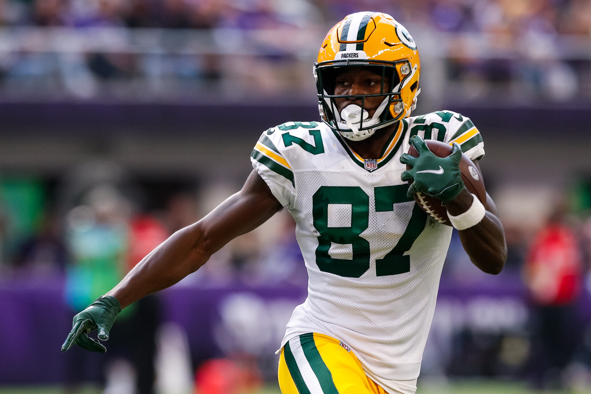 Romeo Doubs #87 of the Green Bay Packers runs with the ball against the Minnesota Vikings in the third quarter of the game at U.S. Bank Stadium on September 11, 2022 in Minneapolis, Minnesota. The Vikings defeated the Packers 23-7.