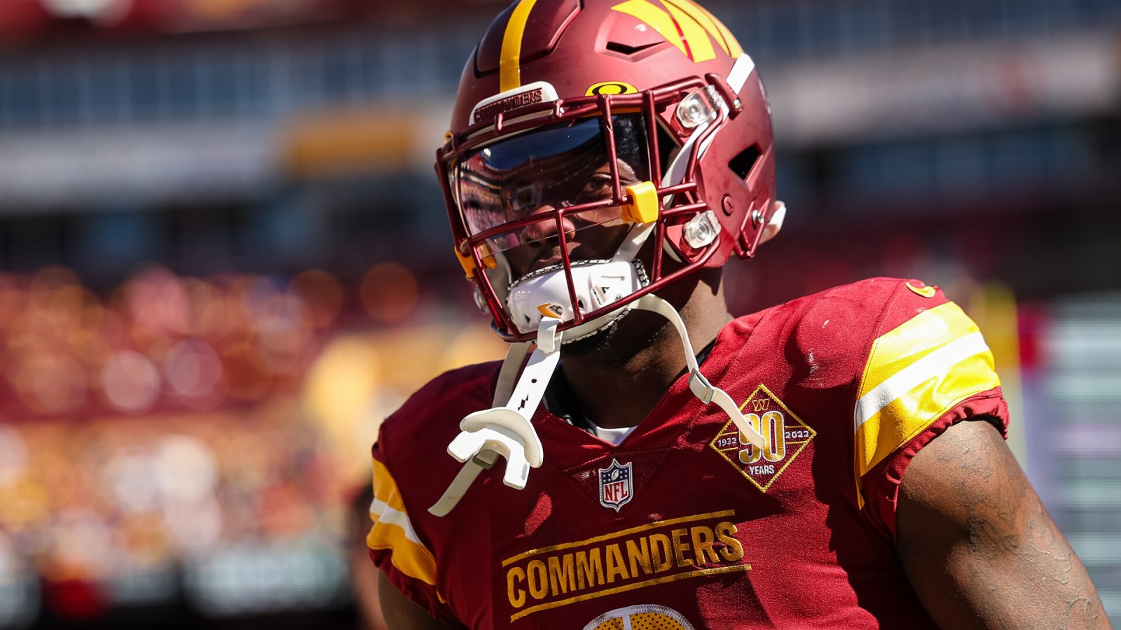 Brian Robinson #8 of the Washington Commanders looks on against the Tennessee Titans during the first half of the game at FedExField on October 9, 2022 in Landover, Maryland.