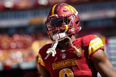 Brian Robinson #8 of the Washington Commanders looks on against the Tennessee Titans during the first half of the game at FedExField on October 9, 2022 in Landover, Maryland.