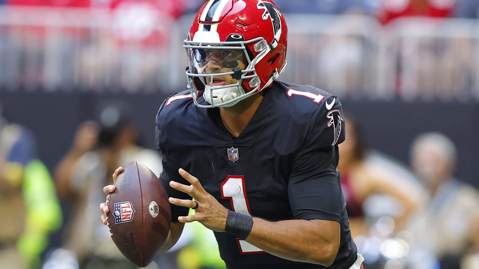 Marcus Mariota #1 of the Atlanta Falcons rolls out to pass during the second half against the San Francisco 49ers at Mercedes-Benz Stadium on October 16, 2022 in Atlanta, Georgia.