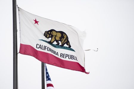 The state flag of California flies near the Los Angeles International Airport on Sunday, May 27, 2018. Negative campaign attacks between Democrats running in crucial House races have begun to tear the party apart in leading up to California's primary election on June 5, 2018.
