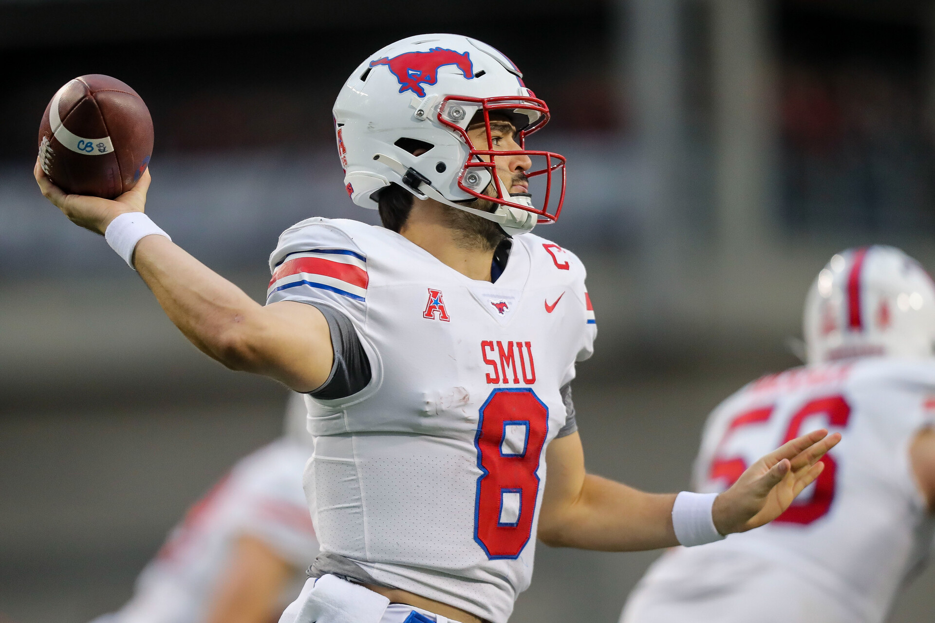 Nov 20, 2021; Cincinnati, Ohio, USA; Southern Methodist Mustangs quarterback Tanner Mordecai (8) throws a pass against the Cincinnati Bearcats in the first half at Nippert Stadium.