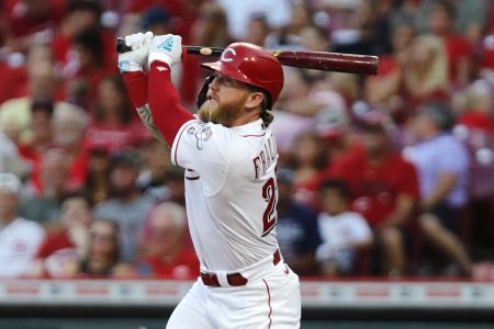 Aug 30, 2022; Cincinnati, Ohio, USA; Cincinnati Reds designated hitter Jake Fraley (27) hits an RBI double against the St. Louis Cardinals during the third inning at Great American Ball Park.